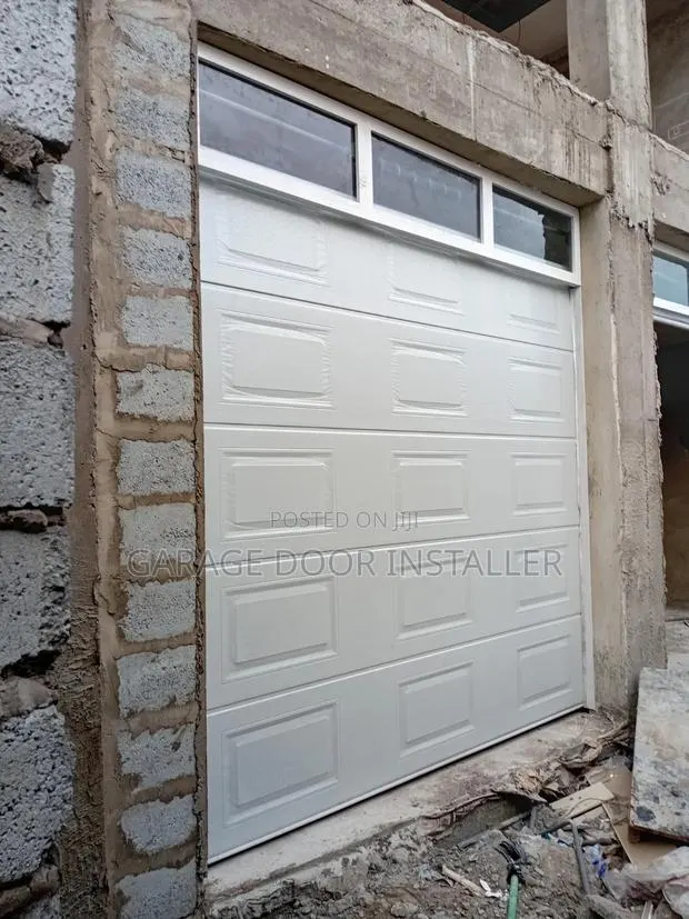 Automatic Garage Door With Fanlight · Photo 1