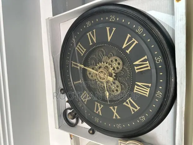 Industrial Black Gold Metal Moving Gears Wall Clock · Photo 1
