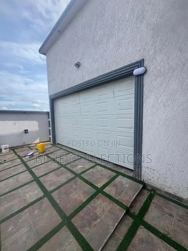 Foreign Automatic Garage Door Opener · Photo 1