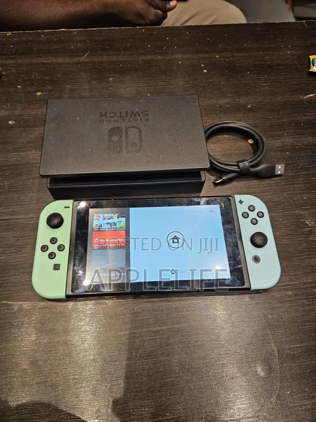Nintendo Switch With Game and Accessories · Photo 1