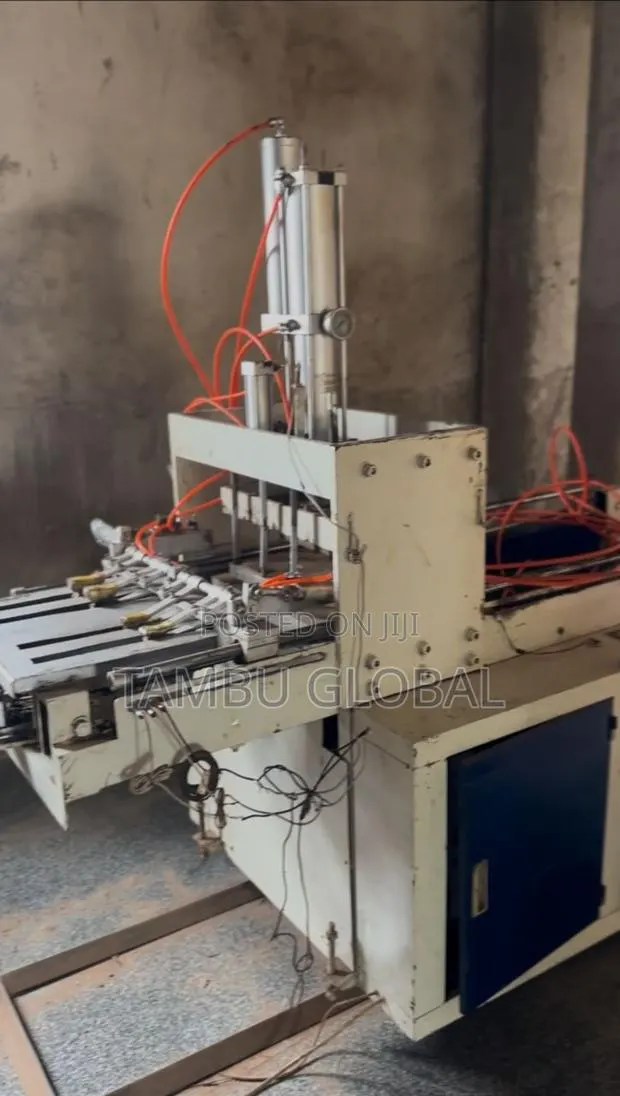 Automatic Plastic Bag Handle-Punching Stacking Machine — Tamale · Photo 2