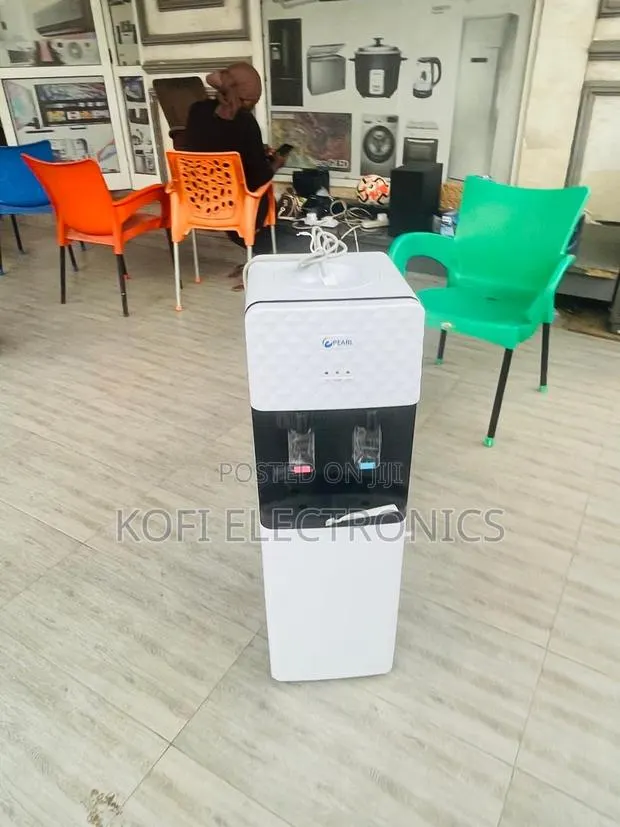 Modern Water Dispenser With Mini Refrigerator Storage · Photo 1