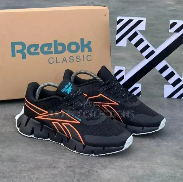 Reebok Classic Black and Orange · Photo 1