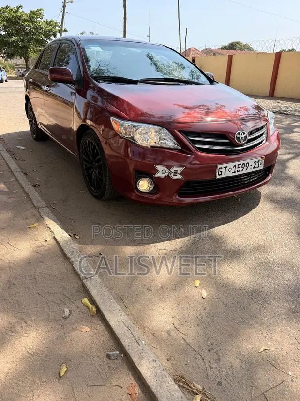 Toyota Corolla LE 4dr Sedan (1.8L 4cyl 4A) 2013 Burgundy · Photo 1