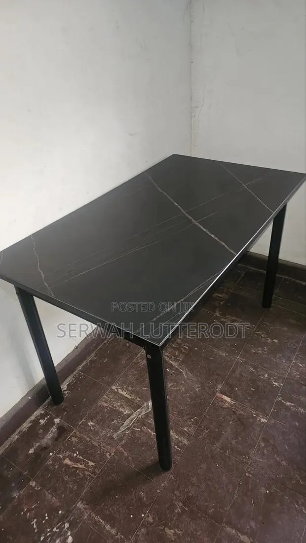 Table and 4 Chairs. (Small Chip on Side of Table) · Photo 1