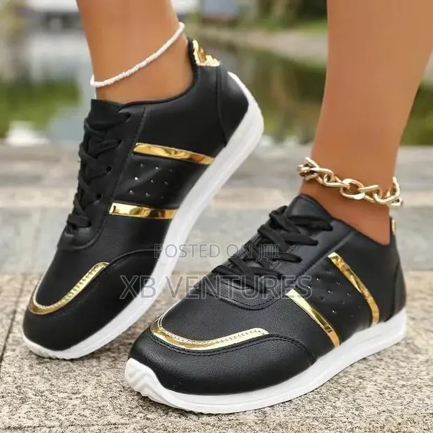 Women's Black and Gold Casual Sneakers · Photo 1