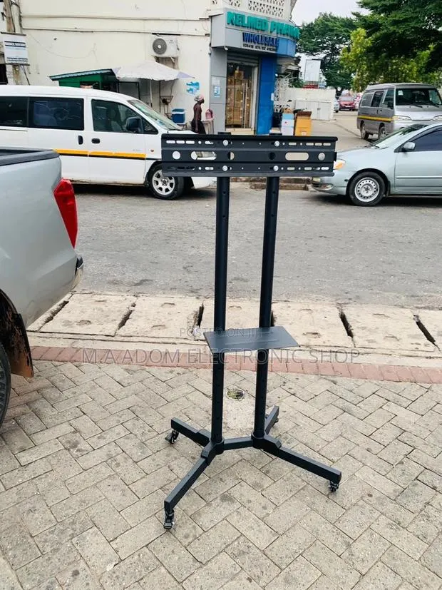 Unique Design Mobile Tv Stand With Wheels for 32-70” Tv. · Photo 1