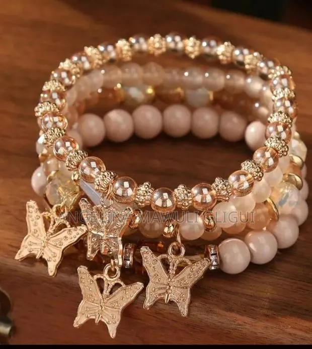 Handcrafted Pink Beaded Charm Bracelets - Set of 4 · Photo 1