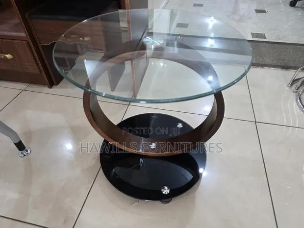 Beautiful Rounded Glass Side Table by an Autistic Interlock Wood Base · Photo 1