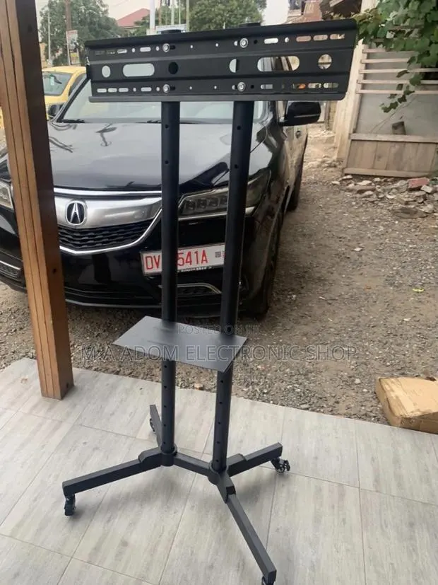 Affordable Mobile Tv Stand With Wheels for 32”-70”Television · Photo 1