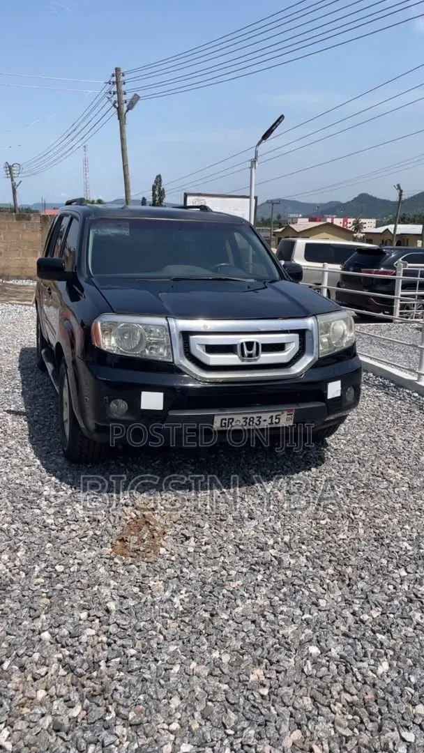 Honda Pilot Touring w/RES/Navi 4WD (3.5L 6cyl 5A) 2012 Black · Photo 1