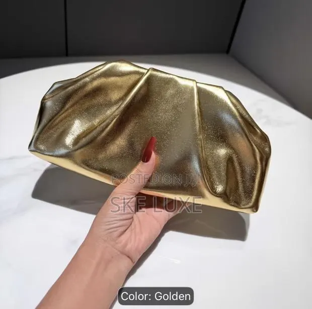 Luxury Metallic Dumpling Clutch Bag - (Gold and Silver) · Photo 1