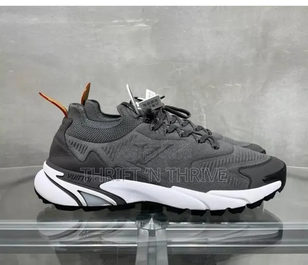 Grey and White Louis Vuitton LV Tatic Knit Sneaker. · Photo 1