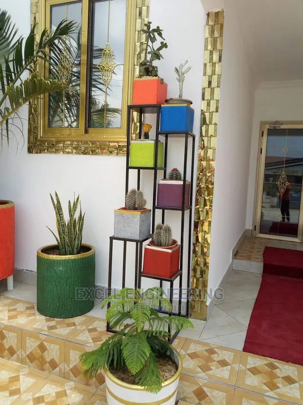 Flower Pot Shelves and Garden Chairs · Photo 1