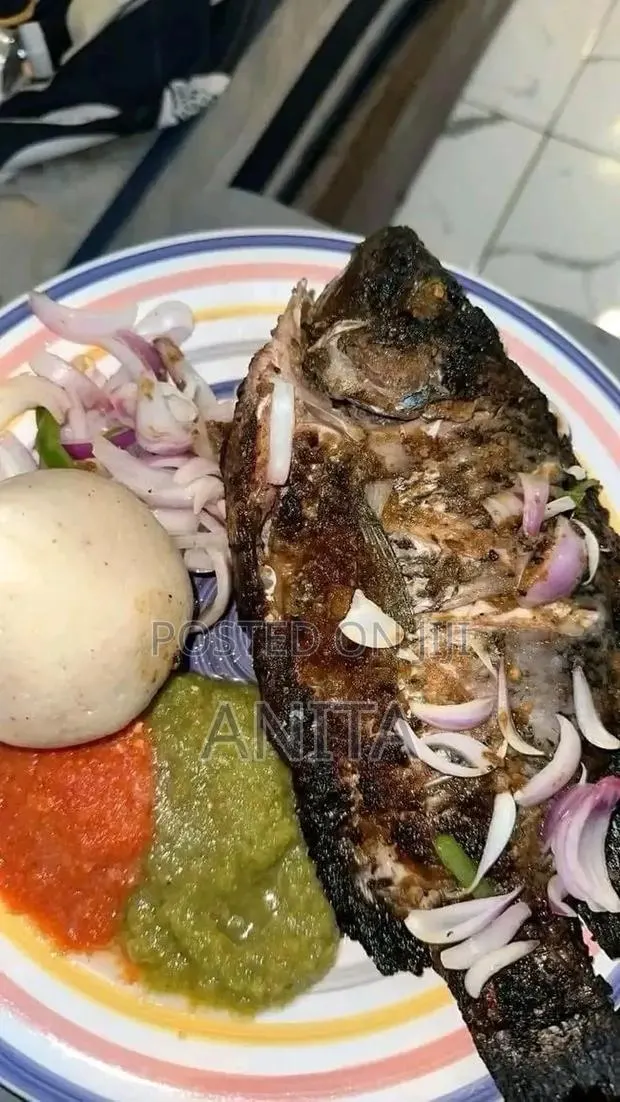 Banku With Tilapia and Hot Pepper · Photo 1