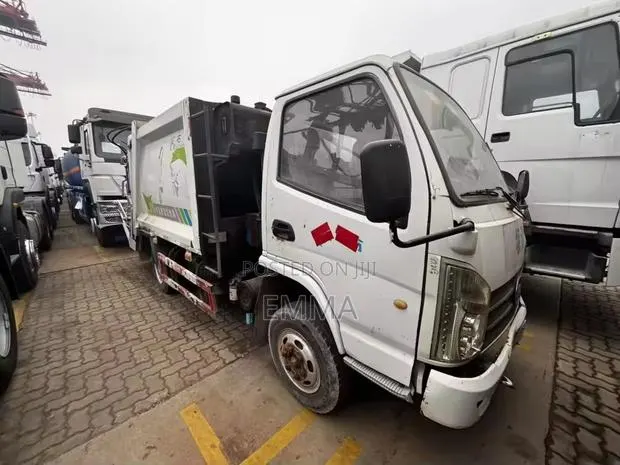 Unregistered Kama Compressed Garbage Truck 2018 White · Photo 1
