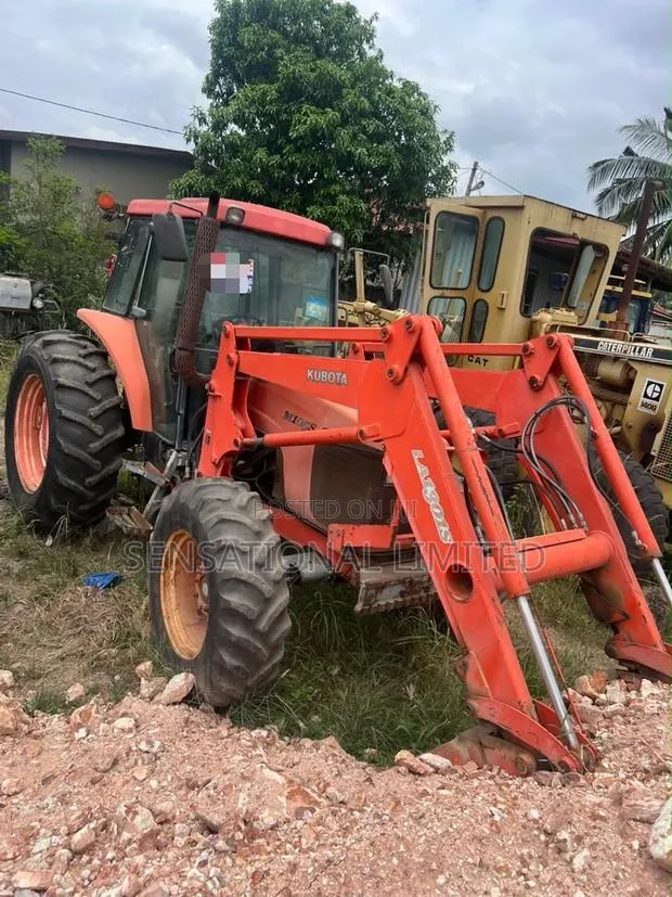 Kubota M105S 4WD Tractor With Front Loader and Wrench · Photo 1