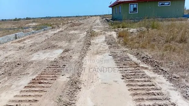 Land + Building Materials in One Deal! Skyportcity Tsopoli · Photo 1