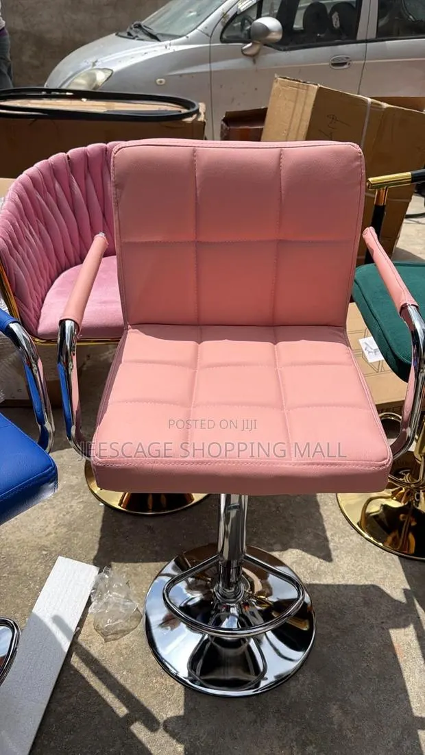 Pink Faux Leather Tufted Adjustable Swivel Bar Stool · Photo 1