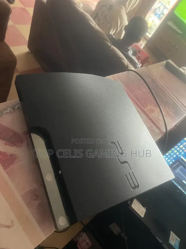 PS3 Slim With Games · Photo 1
