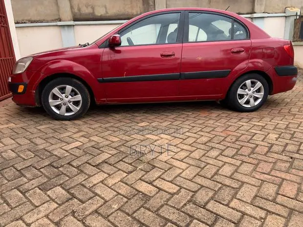 Kia Rio LX 4dr Sedan (1.6L 4cyl 4A) 2010 Red · Photo 1