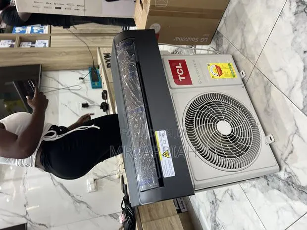 Eco-Friendly TCL 1.5hp Split Dual Inverter Ac(White)Black · Photo 1