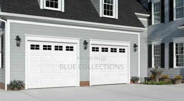 Smart Home Garage Door With Fanlight · Photo 1