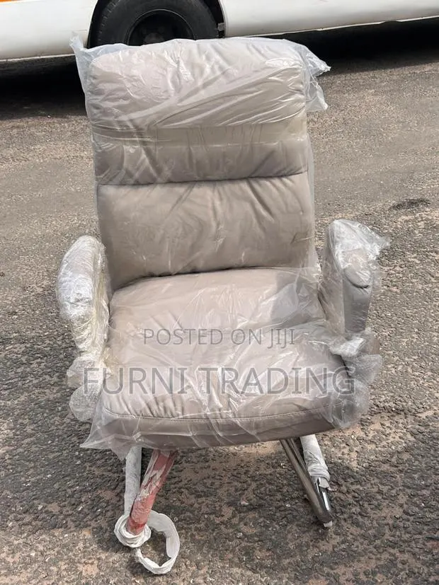 Beige High-Back Padded Chair · Photo 1