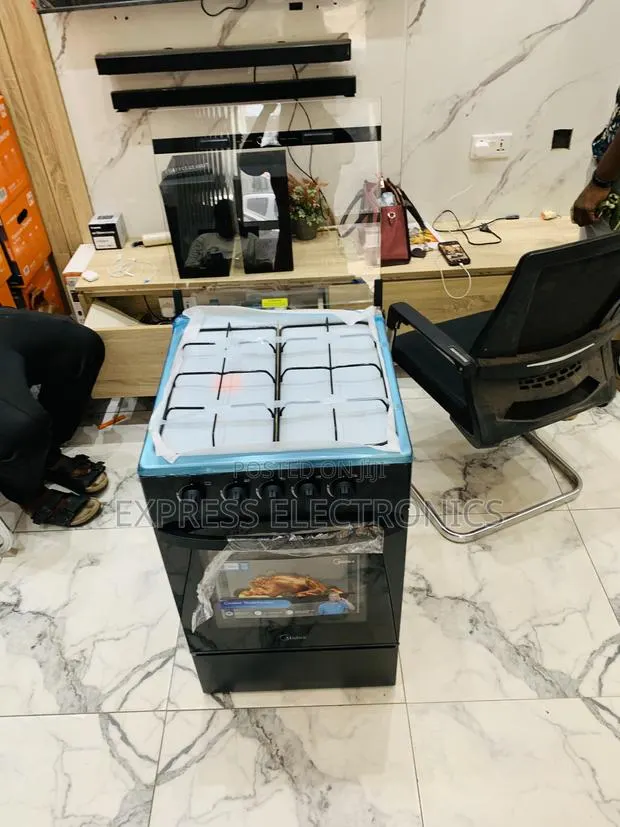 Grab the New Gas Cooker Oven Grill 4burner Midea · Photo 1
