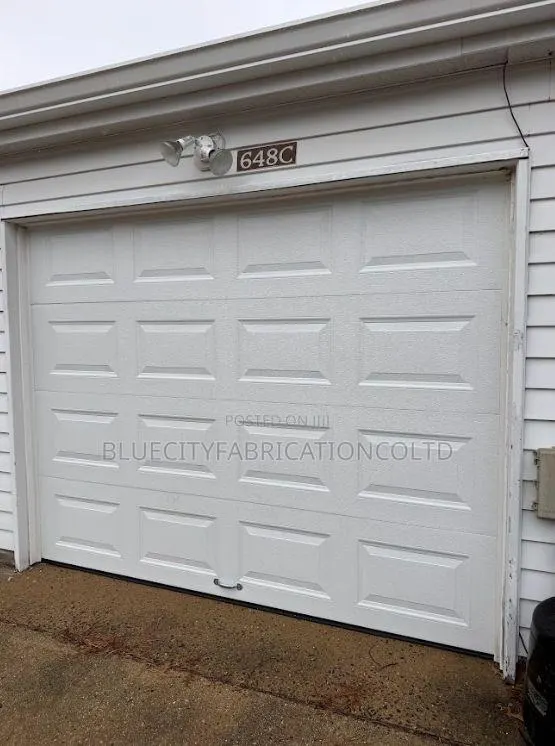 Automatic Garage Door System With Two Remote · Photo 1