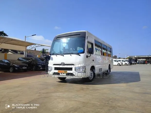 New Toyota Coaster 2025 White · Photo 1