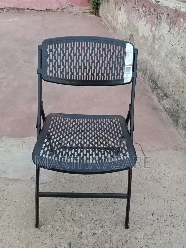 This Is a Commercial-Grade Ventilated Plastic Folding Chair. · Photo 1