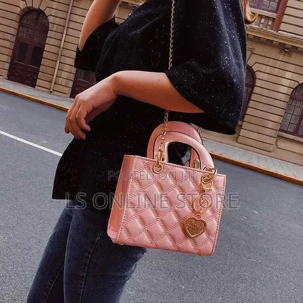 Pink Handbag With Charm · Photo 1