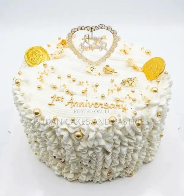 Stunning White and Gold Celebration Cake · Photo 1