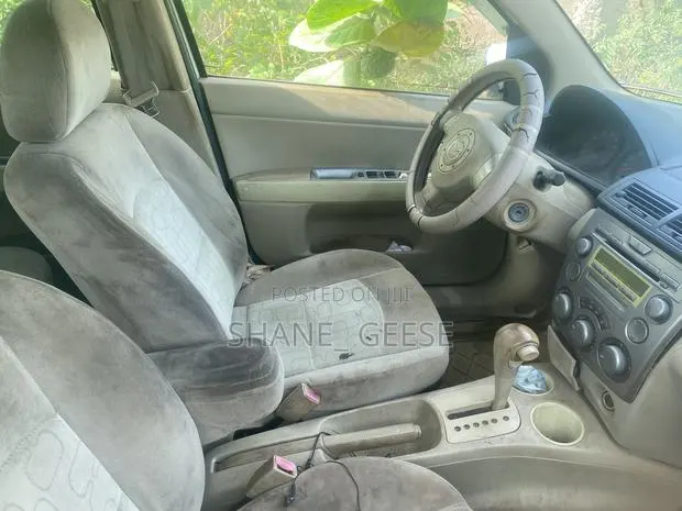 Mazda Demio 2005 White · Photo 1