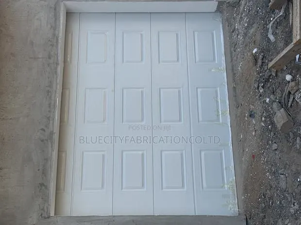 Garage Door With Motor and Two Remote · Photo 1
