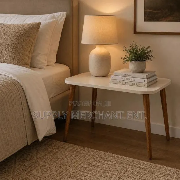 Modern Rectangular Coffee Table With Cream Top Finish & Wooden Legs · Photo 1