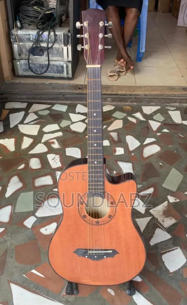 Brown Acoustic Guitar · Photo 1