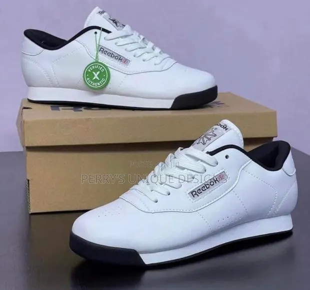 All-White Powerstep Sneakers by Reebok · Photo 1