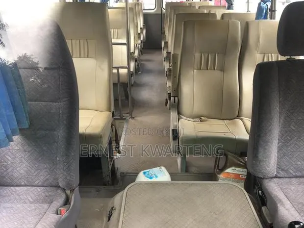 Toyota Coaster 2011 White · Photo 1