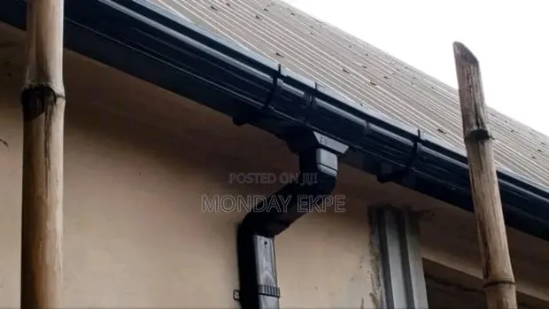 Black PVC Rain Gutter and Installation · Photo 1
