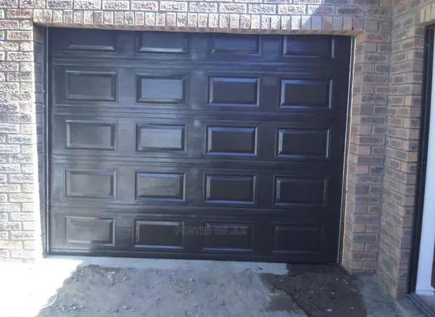 Black Automatic Garage Doors and Main Gate · Photo 1