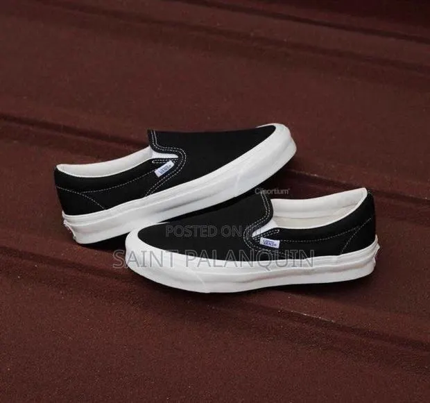 A Classic Black Canvas Vans Slip-on Sneakers · Photo 1