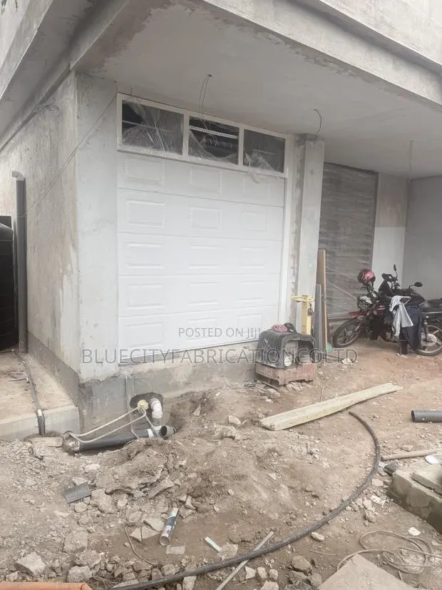 Foreign Automatic, Garage Door With Fix Fan Light · Photo 1