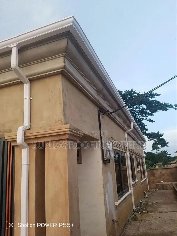 Installed Rain Gutter and Pipe · Photo 1