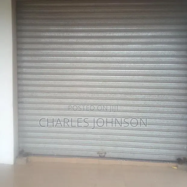 Folding Store Door Installation · Photo 1