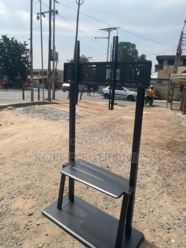 Adjustable Tv Stand Mount Fits 32 to 75 Inch TVS Perfectly · Photo 1