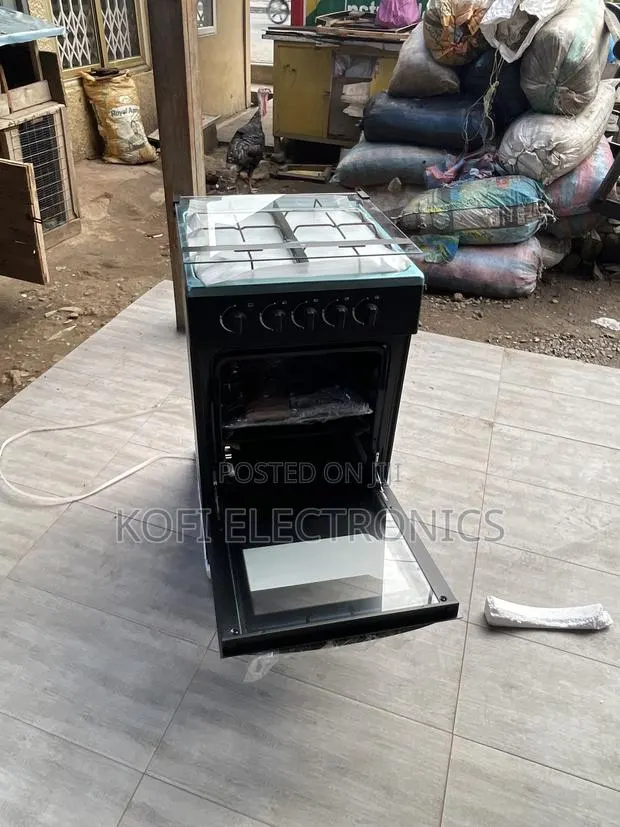 A Double Glass Oven Door Midea 4 Burner Gas Cooker · Photo 1
