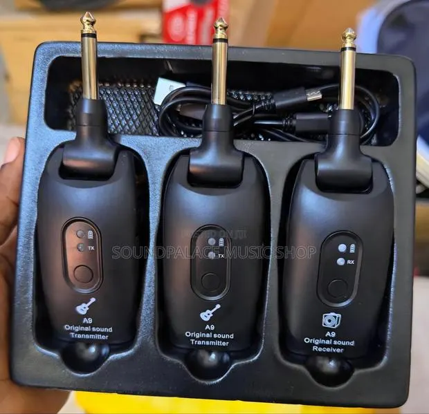 A9 Wireless Guitar System That Includes a Transmitter and a Receiver. · Photo 1