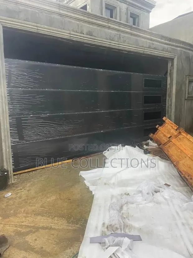 Black Garage With Side Fanlight · Photo 1